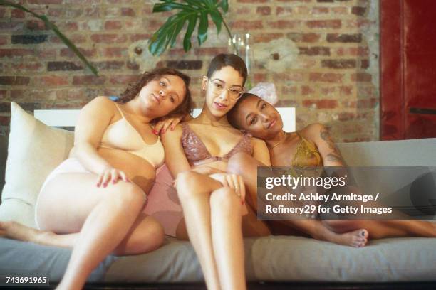 young women on couch - 67percentcollection bildbanksfoton och bilder