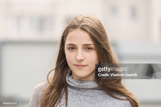 portrait of teenage girl with long brown hair - brown hair stock pictures, royalty-free photos & images