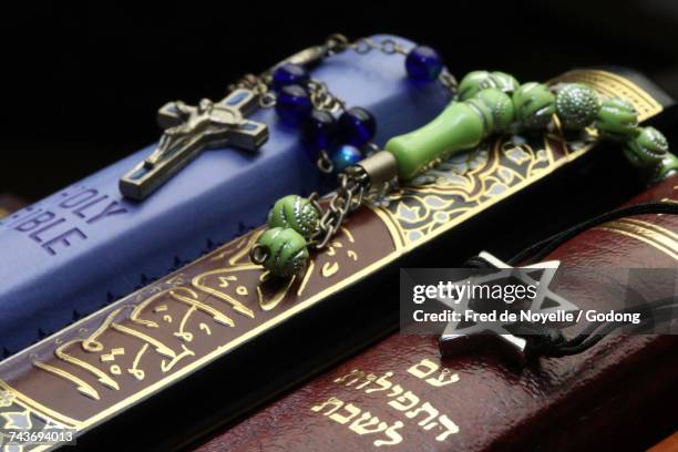 christianity, islam and judaism : 3 monotheistic religions. bible, quran and bible. interfaith symbols.  france. - religious equipment stock pictures, royalty-free photos & images