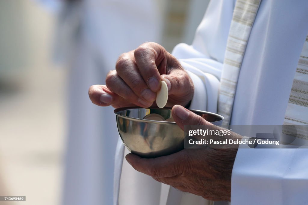 Sanctuary of La Benite Fontaine. Catholic mass. Holy communion. France.