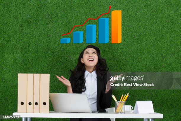 grassland business woman using laptop - curly arrow stock pictures, royalty-free photos & images