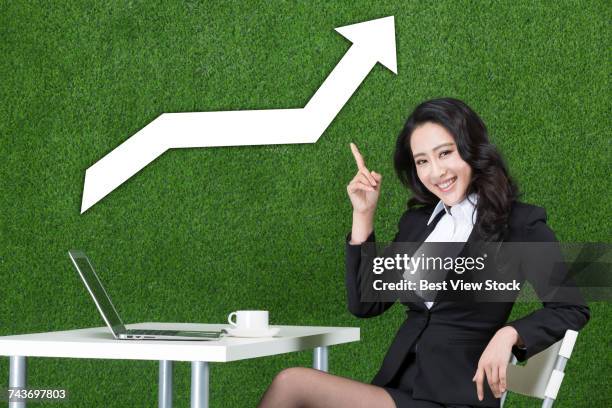 grassland and women fashion business computer - curly arrow stock pictures, royalty-free photos & images