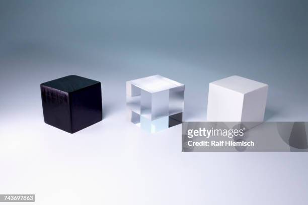 various block shapes arranged side by side on gray background - glass box stock pictures, royalty-free photos & images