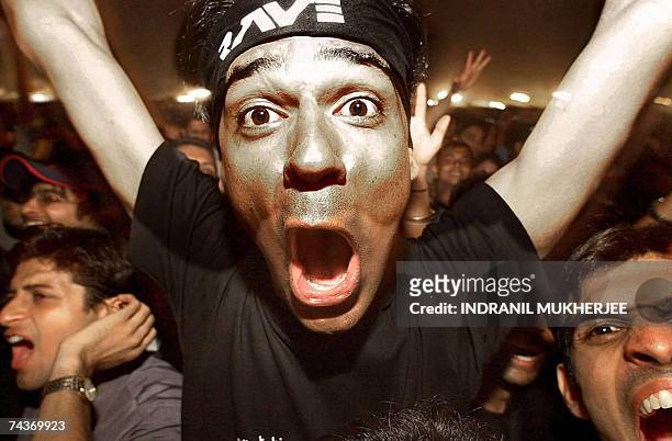 In this picture taken 13 April 2002, Indian fans greet British musician Roger Waters at a concert in Bangalore. Waters, formerly part of the British...