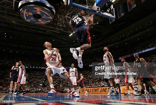 LeBron James of the Cleveland Cavaliers dunks against Tayshaun Prince of the Detroit Pistons in Game Five of the Eastern Conference Finals during the...