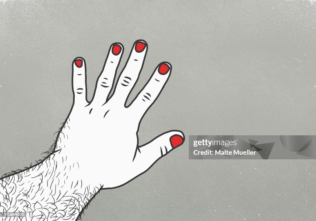 Cropped image of man with red nail polish on finger against gray background