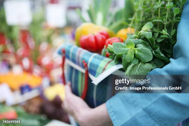 herbs and vegetables from a market - origanum imagens e fotografias de stock