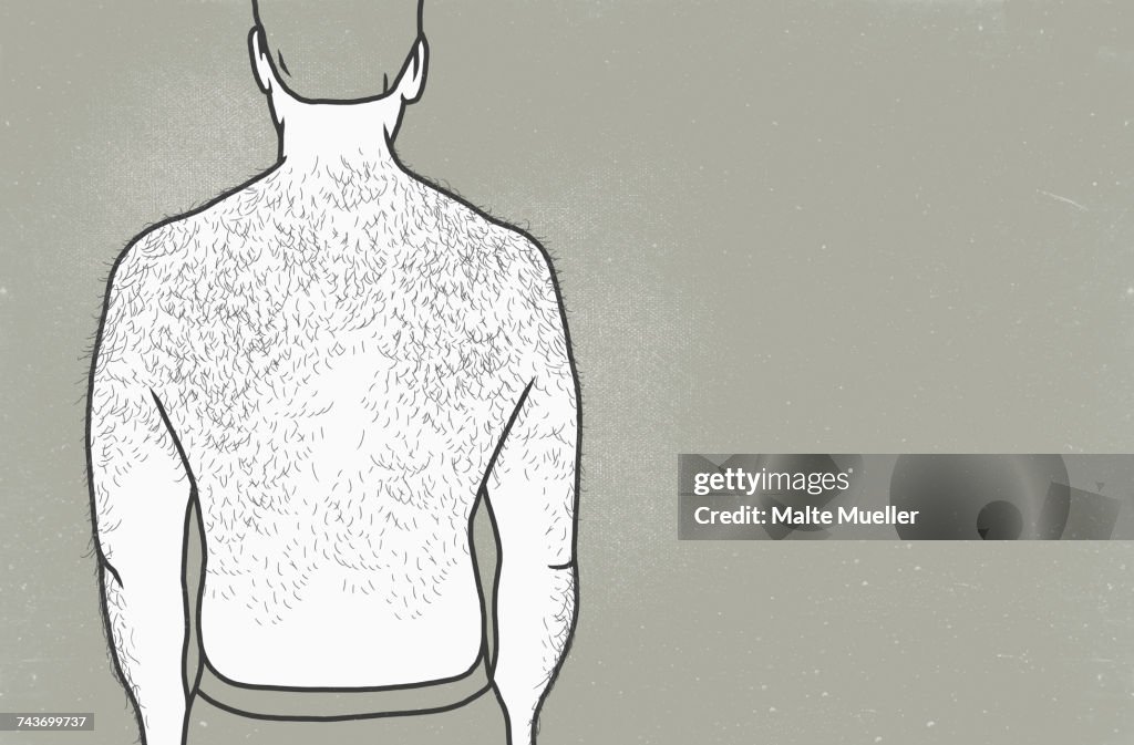 Rear view of man with hairy back against gray background