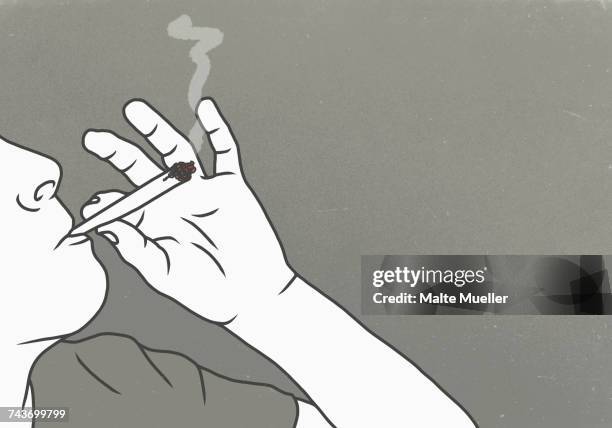 cropped image of man smoking marijuana against gray background - human joint stock-grafiken, -clipart, -cartoons und -symbole