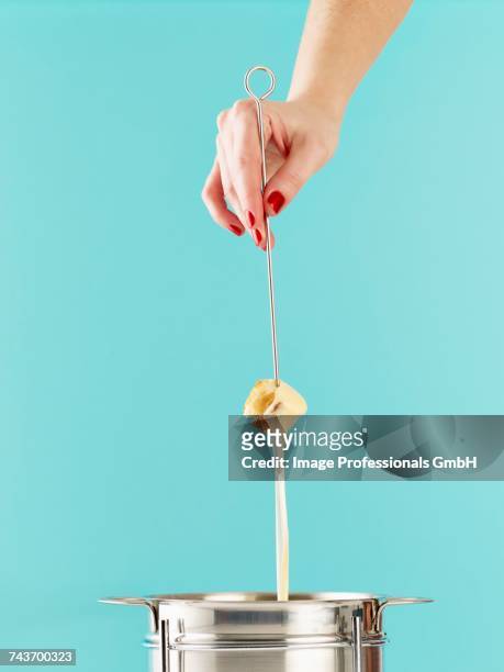 swiss cheese fondue - cheese fondue stock pictures, royalty-free photos & images