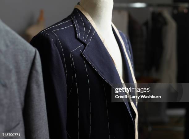 suit jacket on dressmakers model in design studio - kleiderpuppe stock-fotos und bilder