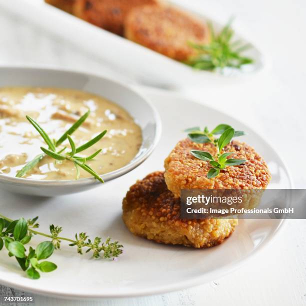 quinoa cakes with a herb and mushroom sauce - origan stock pictures, royalty-free photos & images