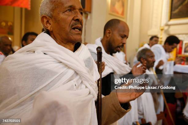 sunday celebration in kidane mhret coptic erytrean church (in santa maria labarum coelis church). italy. - italy migrants stock pictures, royalty-free photos & images