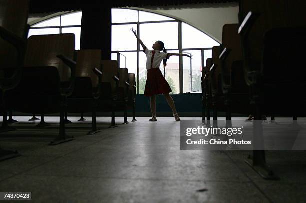 Blind child dances during a rehearsal for the upcoming Children's Day at the Wuhan School for the Blind on May 31, 2007 in Wuhan of Hubei Province,...