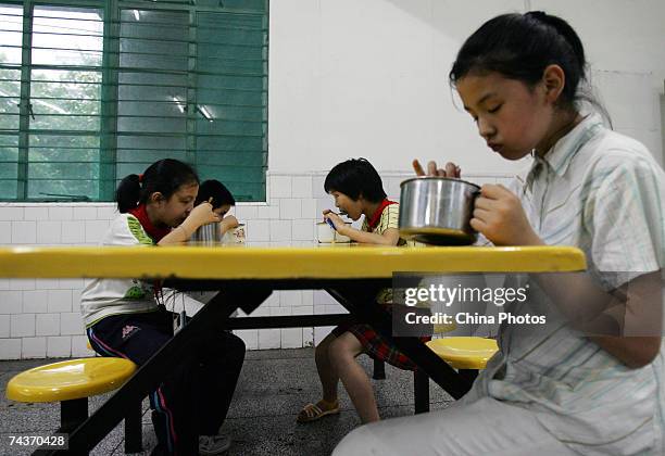 Blind students eats supper at the Wuhan School for the Blind on May 31, 2007 in Wuhan of Hubei Province, China. The Wuhan School for the Blind is the...