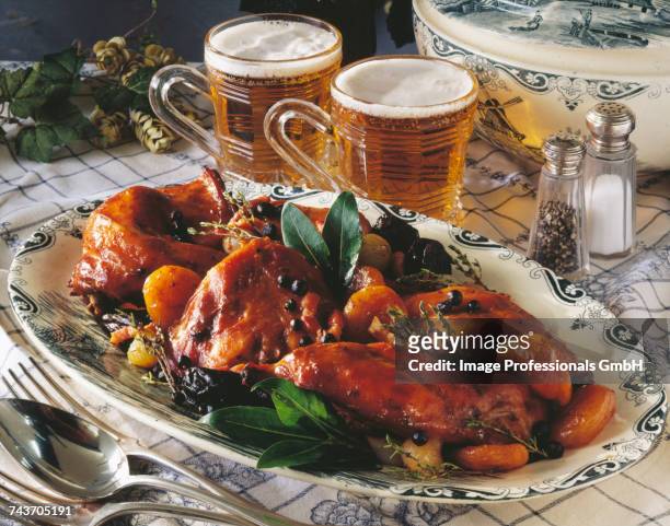 rabbit cooked in beer with dried fruit - belgium food stock pictures, royalty-free photos & images