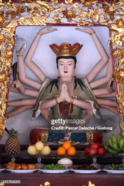 thian hock keng temple.  guan yin. avalokiteshvara bodhisvattva of a thousand arms statue. singapore. - thian hock keng temple stock pictures, royalty-free photos & images