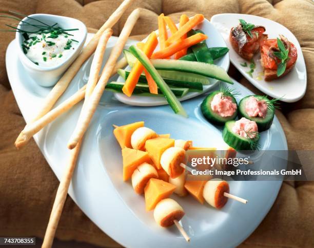 small bread bagnat,cucumber with tarama,diced mimolette and apple grissini,fromage blanc dip - mimolette stock-fotos und bilder