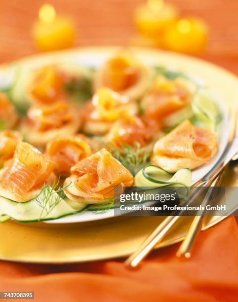 smoked salmon and courgette ribbon bites - blini salmon stock pictures, royalty-free photos & images