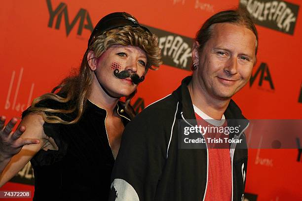 Jerry Cantrell of Alice in Chains poses with a Lucen Dossier performer at the Black Light Burns Release Party at the Vanguard on May 31, 2007 in...