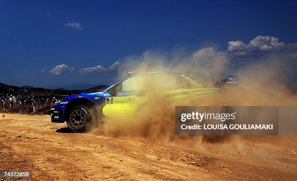 Norway's Petter Solberg with Philip Mills of Britain drive their Subaru Impreza during the first leg-section two of the WRC Acropolis Rally of Greece...