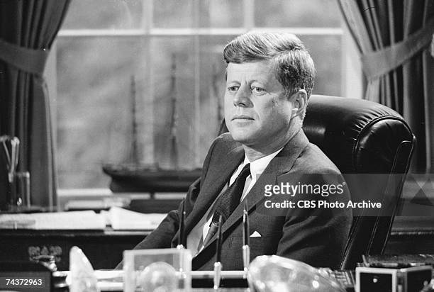 Portrait of American President John F. Kennedy in the White House during the filming a televised interview entitled 'CBS Reports: Breaking the Trade...