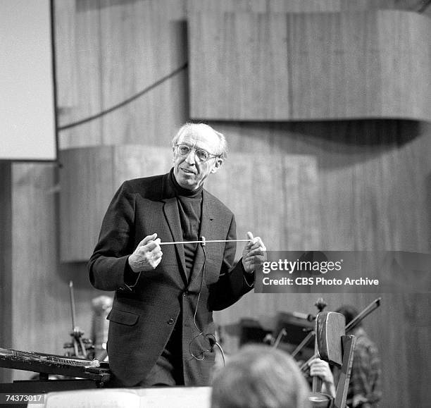 American composer and conductor Aaron Copland holds his baton during rehersals for one of his televised 'Young People's Concerts' featuring the New...