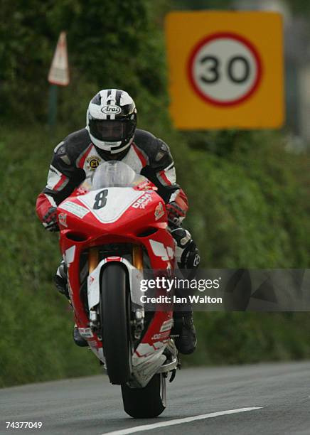 Guy Martin exits Kirk Michael during practice of the Isle of Man TT Races June 1, 2007 in Kirk Michael, in Isle of Man, United Kingdom.