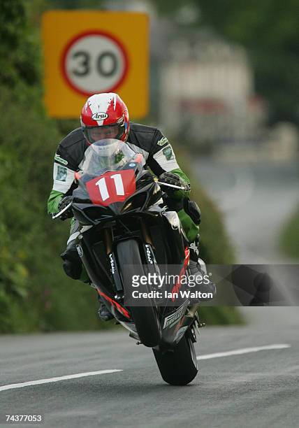 Gary Carswell exits Kirk Michael during practice of the Isle of Man TT Races June 1, 2007 in Kirk Michael, in Isle of Man, United Kingdom.