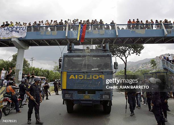 Riot police patrols the streets of Caracas as students rally against Venezuelan President Hugo Chavez's decision of not renewing the broadcasting...