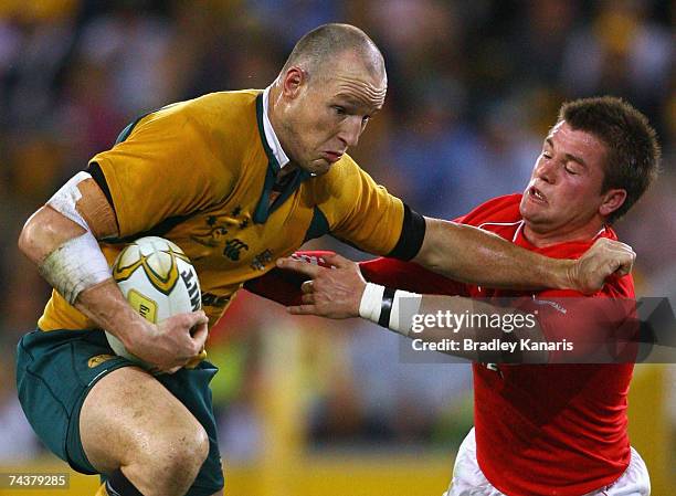 Stirling Mortlock of the Wallabies attempts to break free from the Welsh defence during the Second Test between Australia and Wales at Suncorp...