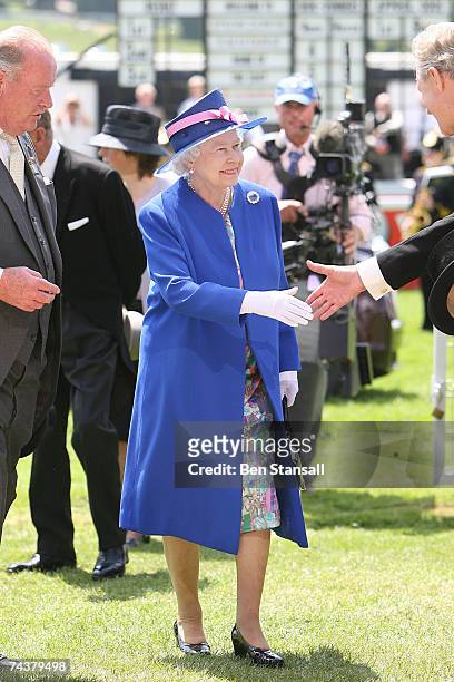 Britain's Queen Elizabeth II arrives on Derby Day at the Epsom Derby on June 2, 2007 in Surrey, England.
