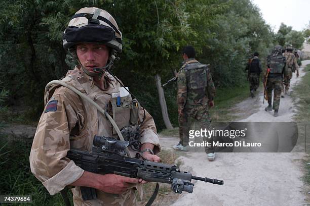 British Army Officer, Second Lieutenant Alex Forster from the The Inkerman Company, 1st Battalion Grenadier Guards Regiment patrol is area of...