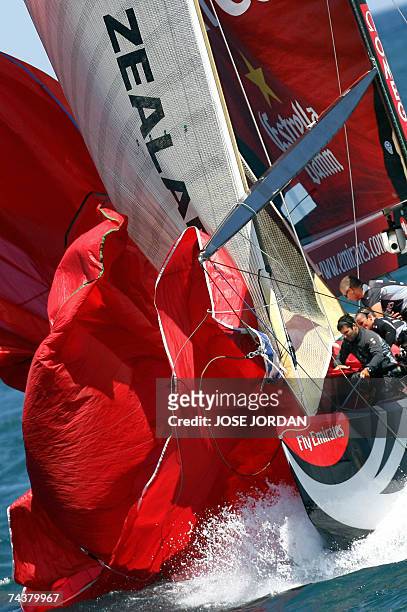 Members of Emirates Team New Zealand save the spinaker on the second day of sailing in the final of the Louis Vuitton Cup in Valencia, 02 June 2007....