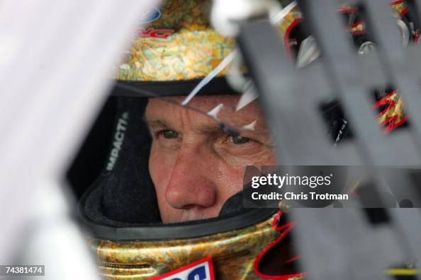 Snickers Dark Car Ricky Rudd Ricky Rudd, driver of the Snickers Ford, sits in his car during... News ...
