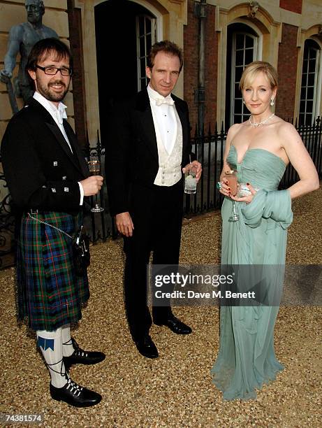Author J.K. Rowling, her husband Neil Murray and actor Ralph Fiennes arrive at the Raisa Gorbachev Foundation Party at the Hampton Court Palace on...