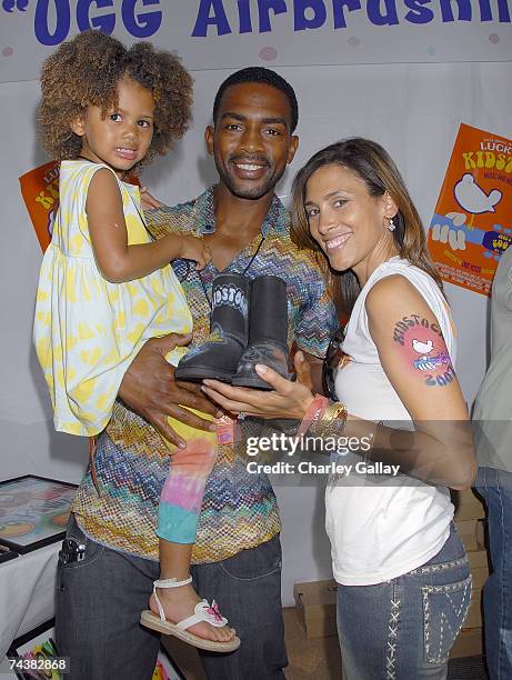 Actor Bill Bellamy , daughter Bailey Ivory-Rose Bellamy and wife Kristen Baker pose with freshly airbrushed UGG boots at the Kidstock Music and Art...