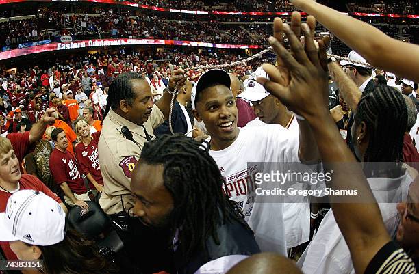 Daniel Gibson of the Cleveland Cavaliers celebrates with fans as he walks off the court after the Cavs 98-82 win against the Detroit Pistons in Game...
