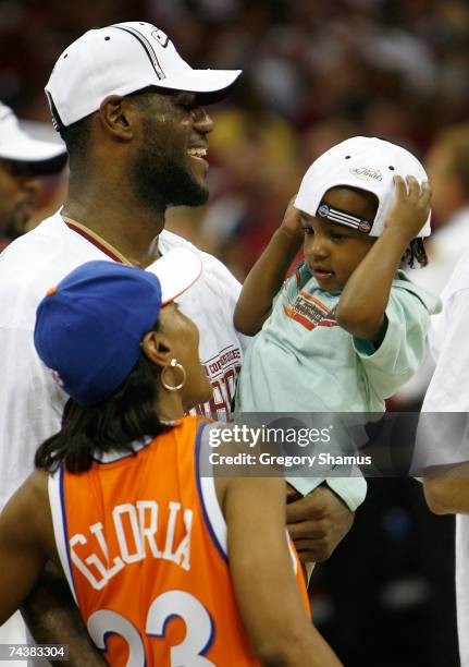 LeBron James of the Cleveland Cavaliers celebrates with his son LeBron Jr. And his mother Gloria after their 98-82 win against the Detroit Pistons in...