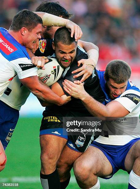 Evarn Tuimavave of the Warriors gets tackled during the round 12 NRL match between the Warriors and the Bulldogs at Mt Smart Stadium June 3, 2007 in...