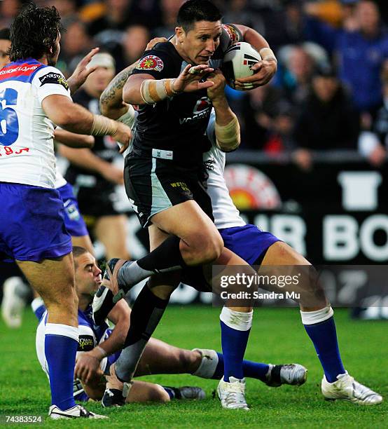 Steve Price of the Warriors is tackled during the round 12 NRL match between the Warriors and the Bulldogs at Mt Smart Stadium June 3, 2007 in...