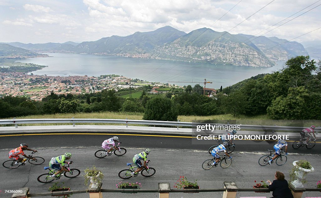 Italy's Danilo Di Luca (C) rides with th...