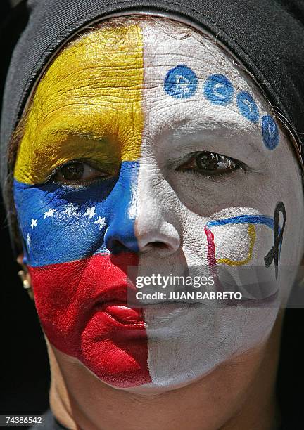 An opponent of Venezuelan President Hugo Chavez takes part in a demonstration against Chavez's refusal to renew RCTV's broadcasting license on June...