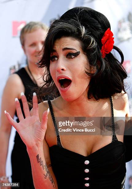 Musician Amy Winehouse arrives to the 2007 MTV Movie Awards held at the Gibson Amphitheatre on June 3, 2007 in Universal City, California.