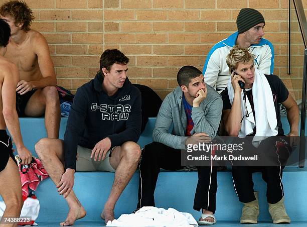 Justin Koschitzke, Leigh Montagna, Stephen Milne and Nick Riewoldt of the Saints prepare for the St Kilda Saints AFL recovery session at St Leonards...