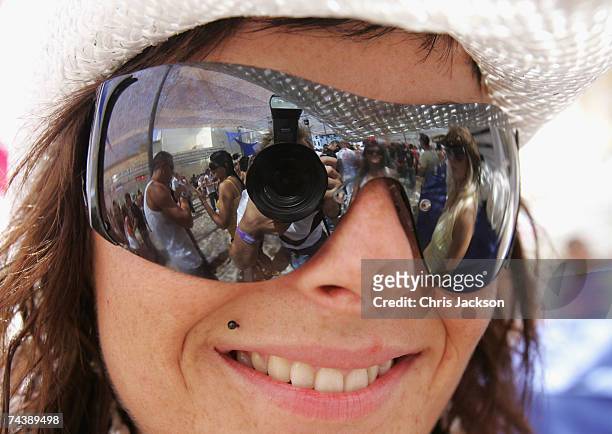 Clubber poses for a photograph during the opening matinee at Space nightclub on June 3, 2007 in Spain Ibiza. The matinee is an all day event and...