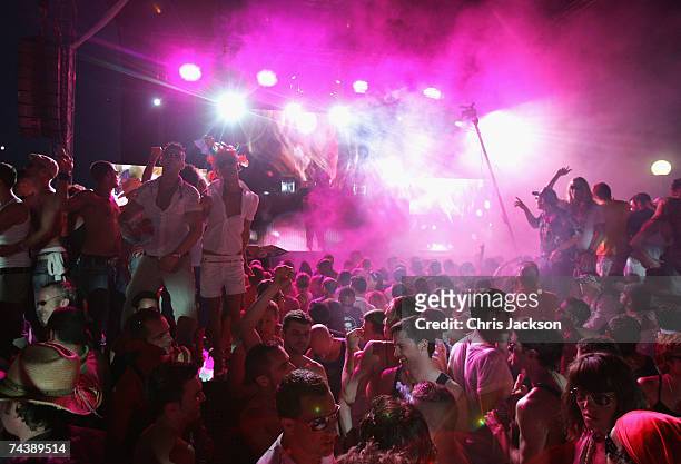 Clubbers dance during the opening matinee at Space nightclub on June 3, 2007 in Spain Ibiza. The matinee is an all day event and starts at eight in...