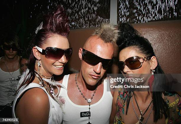 Clubbers pose for photographs during the matinee at Space nightclub on June 3, 2007 in Spain Ibiza. The matinee is an all day event and starts at...