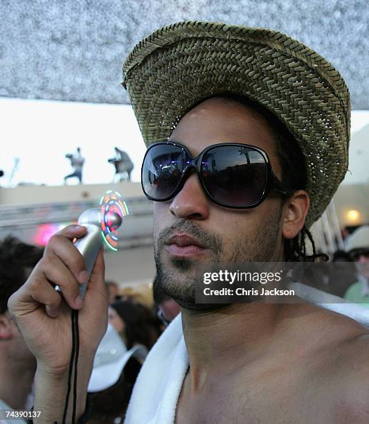 Clubber cools off as he enjoys the opening matinee at Space nightclub on June 3, 2007 in Spain Ibiza. The matinee is an all day event and starts at...