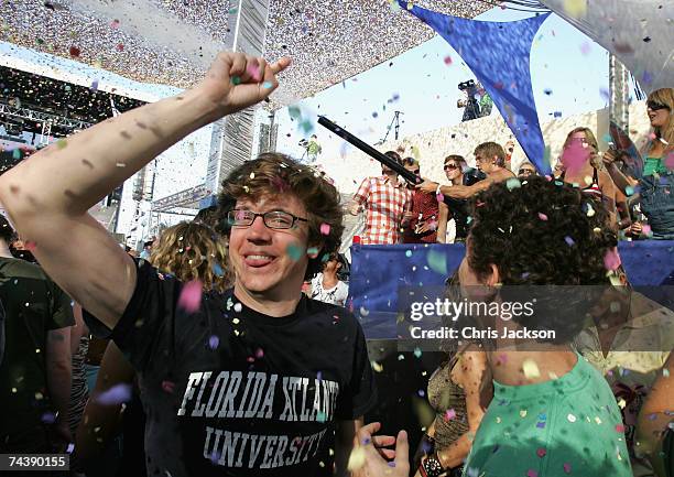 Clubbers dance as a confetti cannon fires during the matinee at Space nightclub on June 3, 2007 in Spain Ibiza. The matinee is an all day event and...